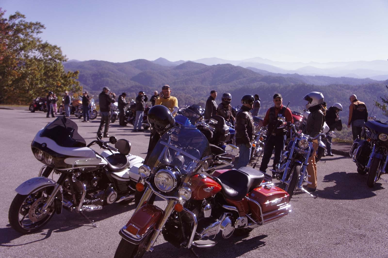 Cruisers gathered at a mountain overlook on a group ride stop