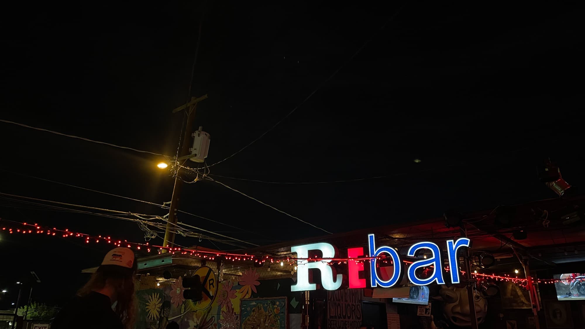 The neon sign of a local Las Vegas bar glowing at night